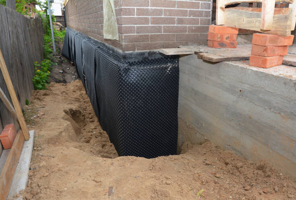 Happy homeowners after waterproofing job in Commack